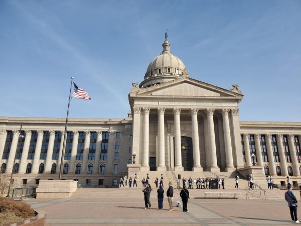 People gather in front of the Oklahoma State Capitol building.