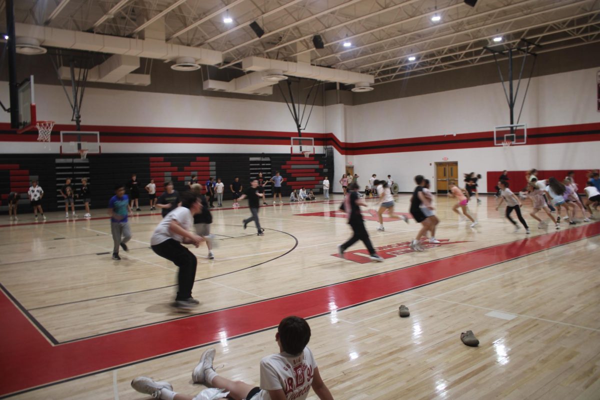 Students Running in the Gym