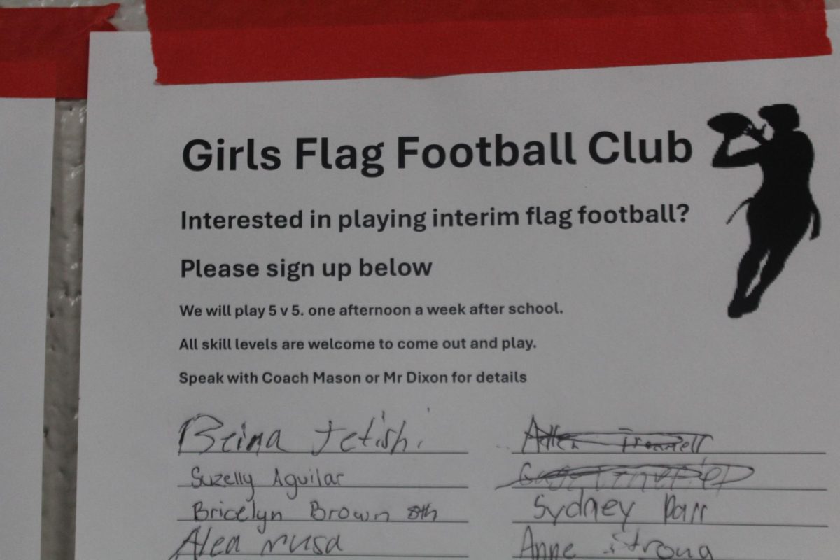 A sign-up sheet showcases the names of girls wanting to play flag football.